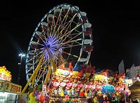 brightly lit ferris wheel at night